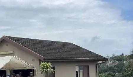 One shot and three held hostage in their home.