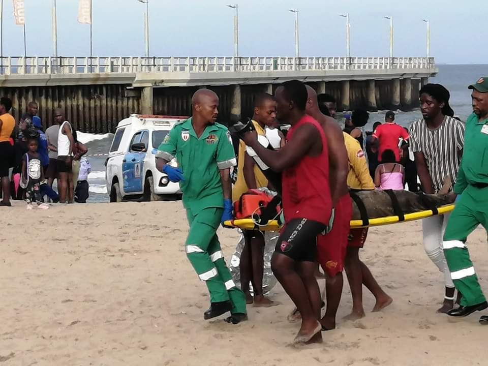 Three dead after freak wave sweeps beach goers against pier at Durban North Beach. 