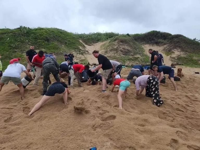 Woman rescued after beach trench collapses, trapping her for an hour