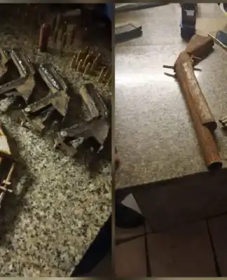 During the search, officers discovered a homemade shotgun, 20 homemade revolvers, and an undisclosed amount of unaccounted ammunition